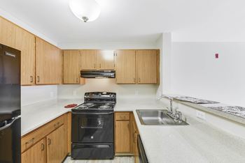 Eat-in kitchen table with sink at manor at victoria park, temple hills, maryland